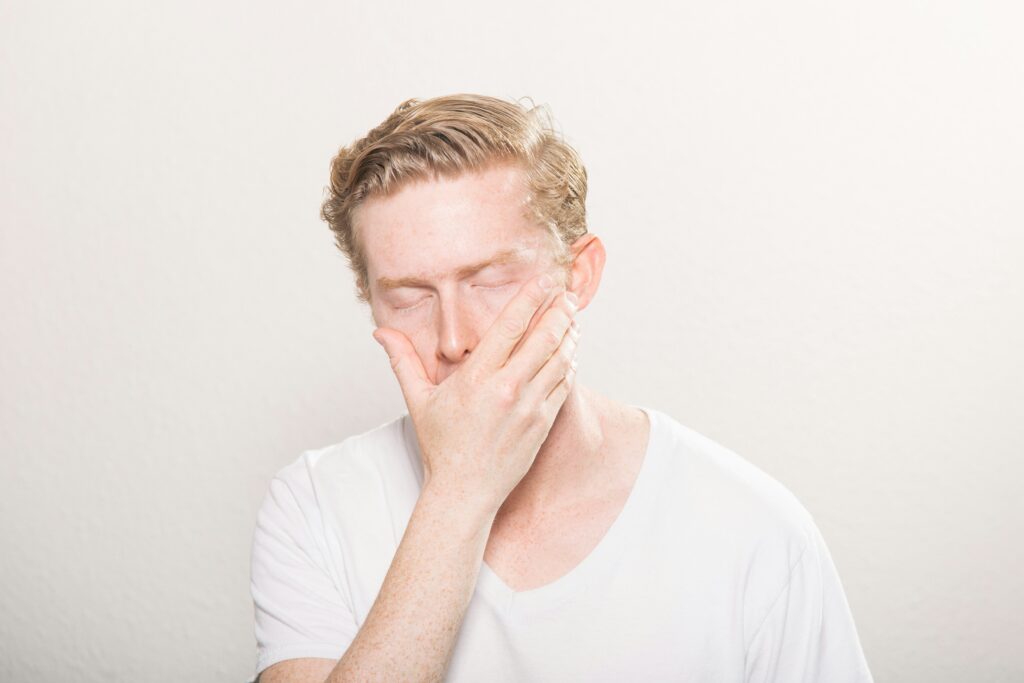 What Does Strep Throat Look Like? covering throat redness, swollen tonsils, white spots, fever, and other recognizable symptoms.